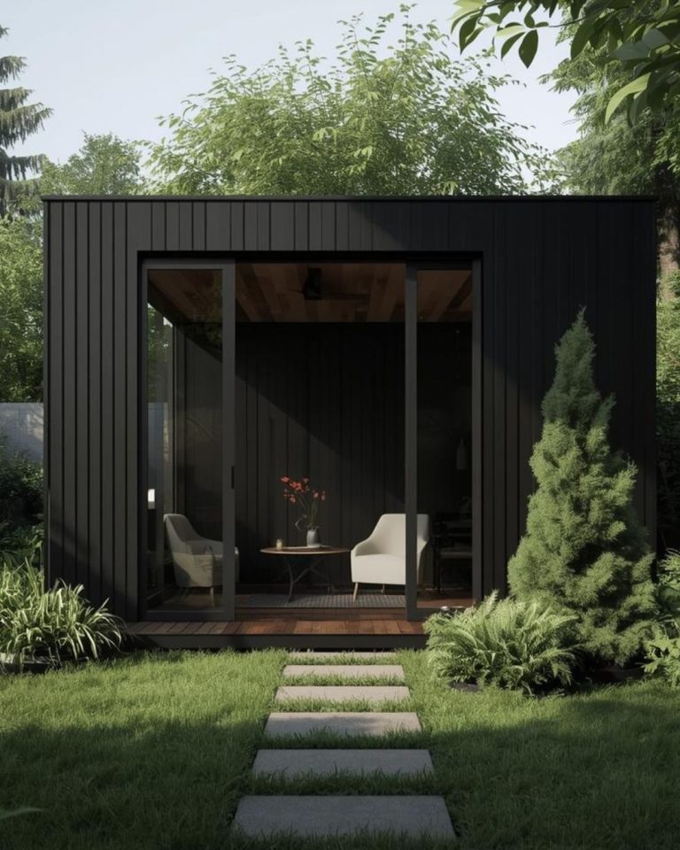 Modern black clad garden room in Hove garden