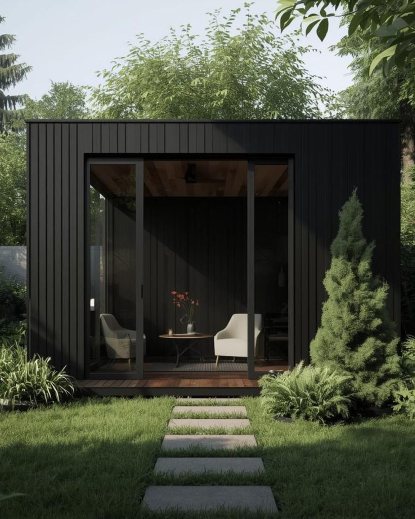 Modern black clad garden room in Hove garden